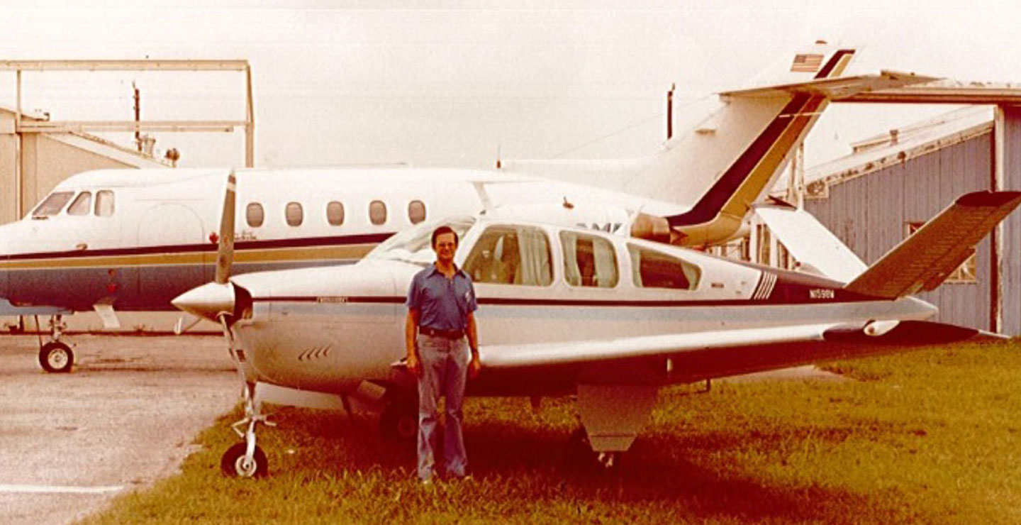 Photo of Huntly Millar Standing by a Plane